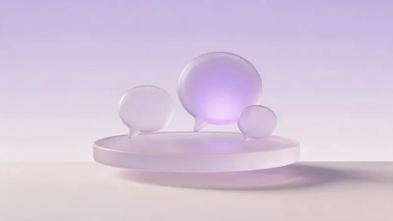 Three glass speech bubbles of different sizes on one tray, a small team sharing one inbox